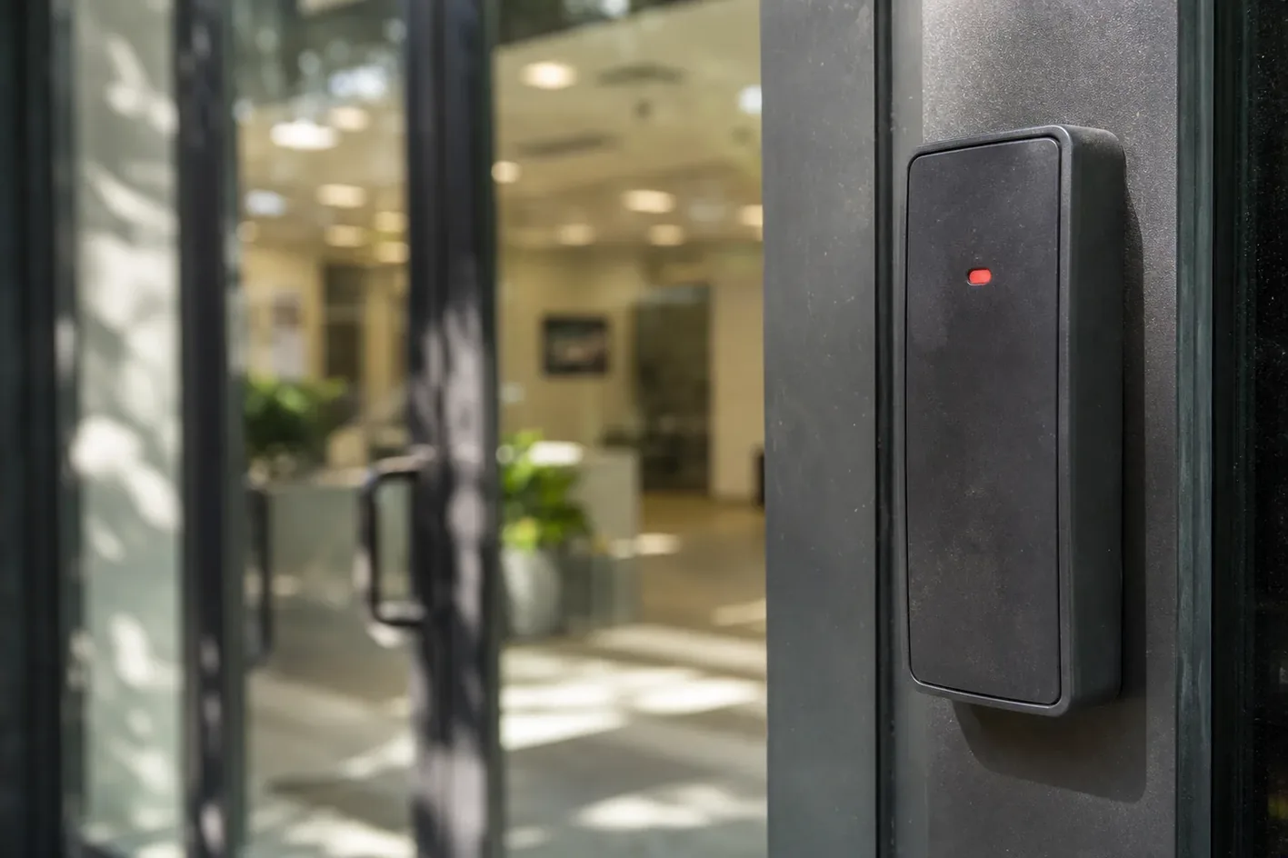 Access control card reader beside an office door in TN